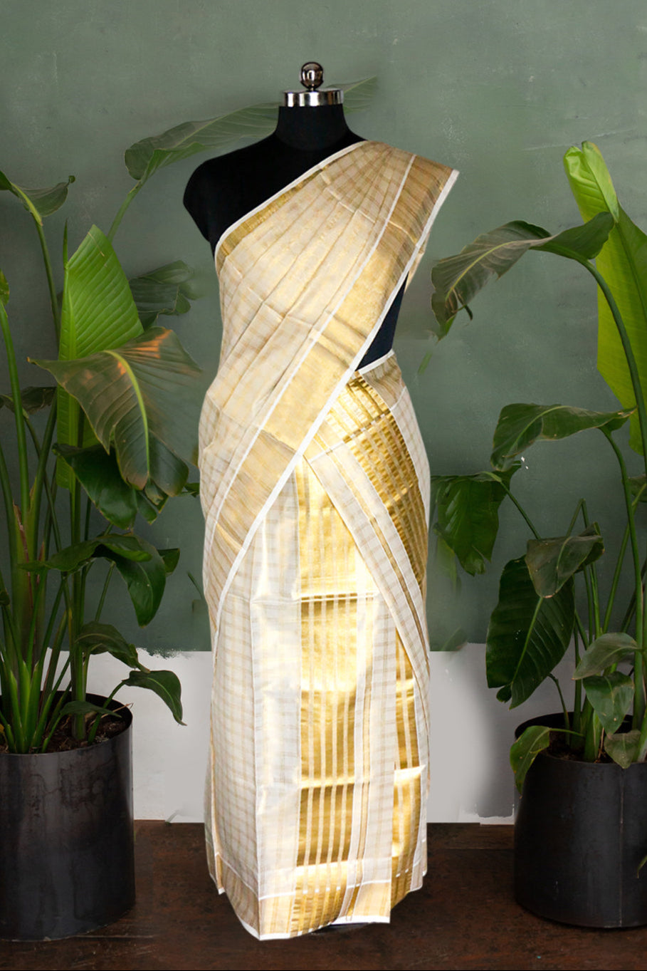 Saree on a mannequin with plants in the background