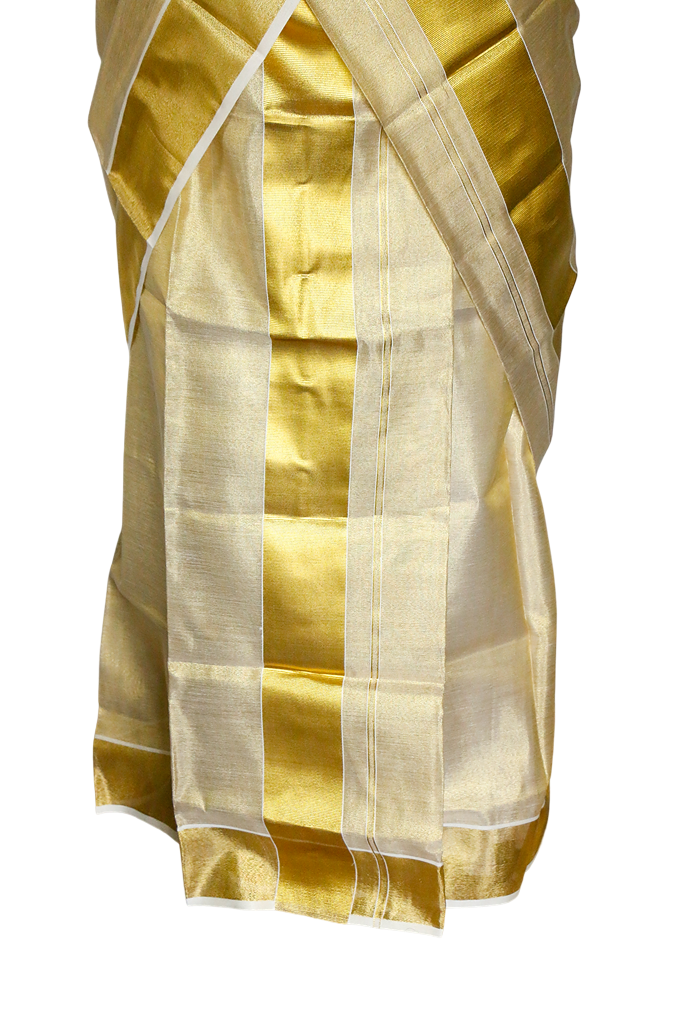 Gold and white saree with a plain background