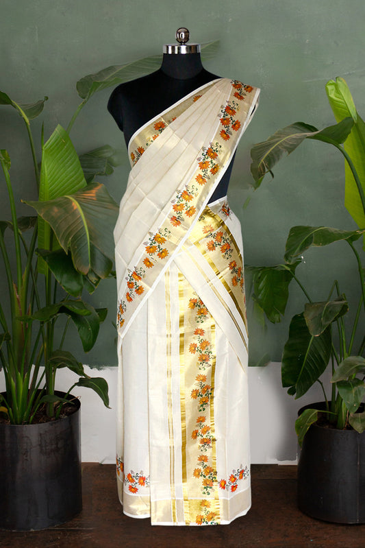 White saree with floral patterns on a mannequin against a green wall with plants.