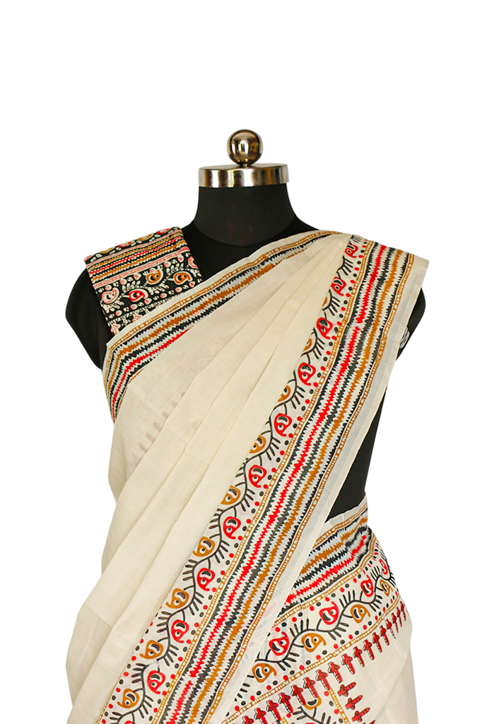 Beige saree with colorful patterns on a mannequin against a white background