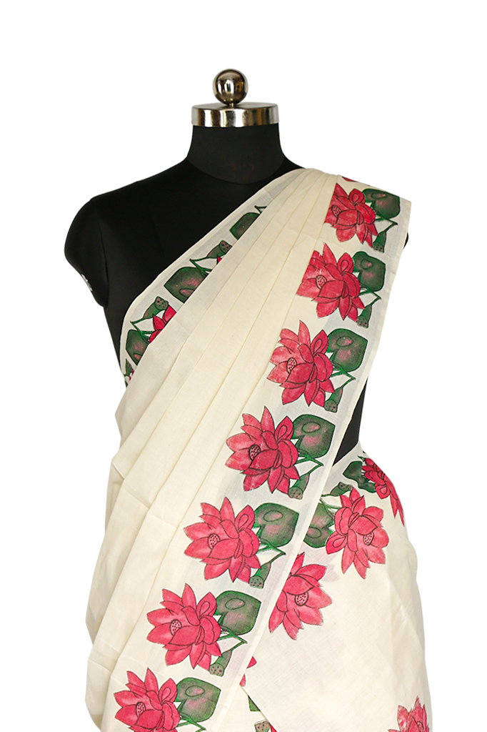 White saree with pink floral patterns on a mannequin against a white background